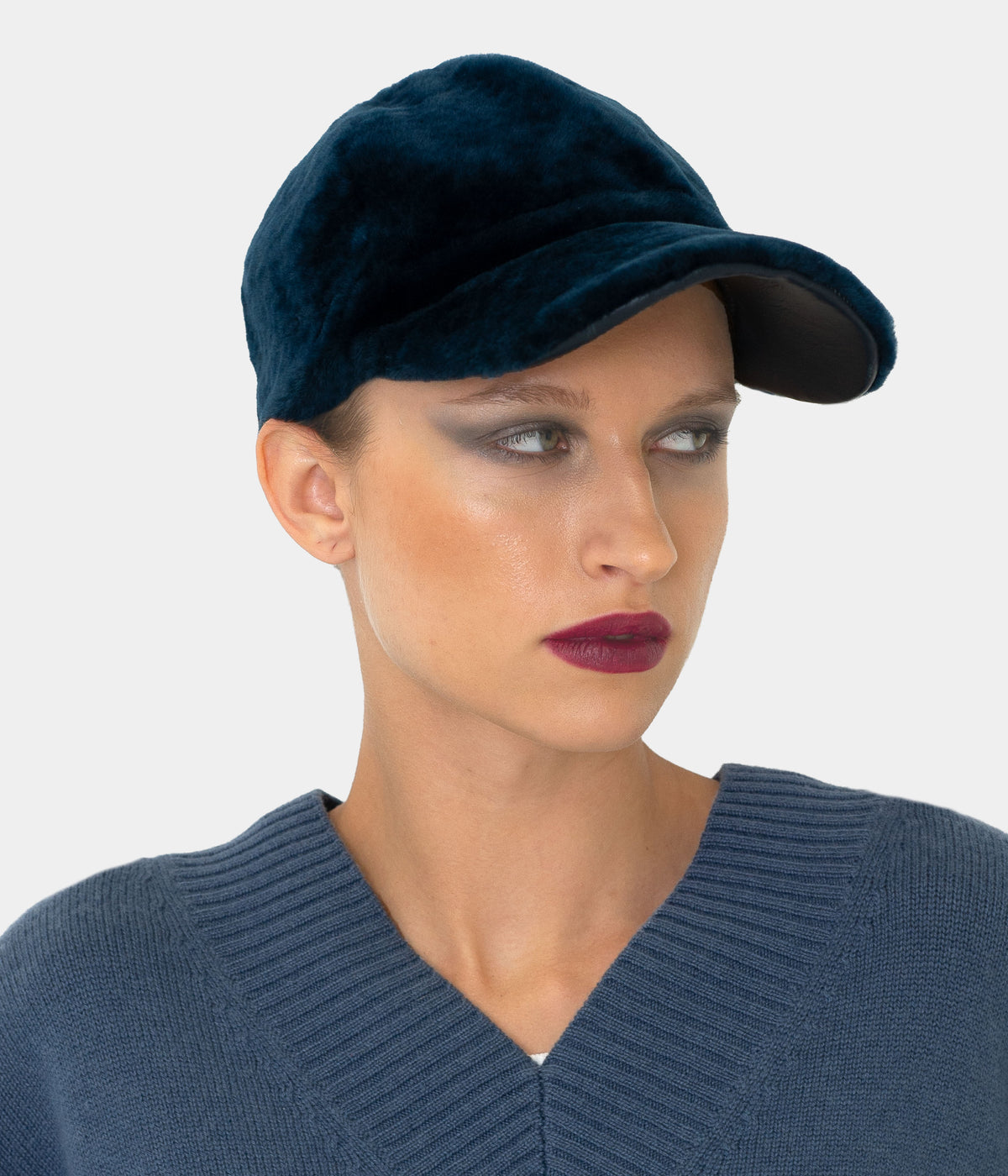 Model wearing the Dom Goor cerulean blue shearling baseball cap, three-quarter view