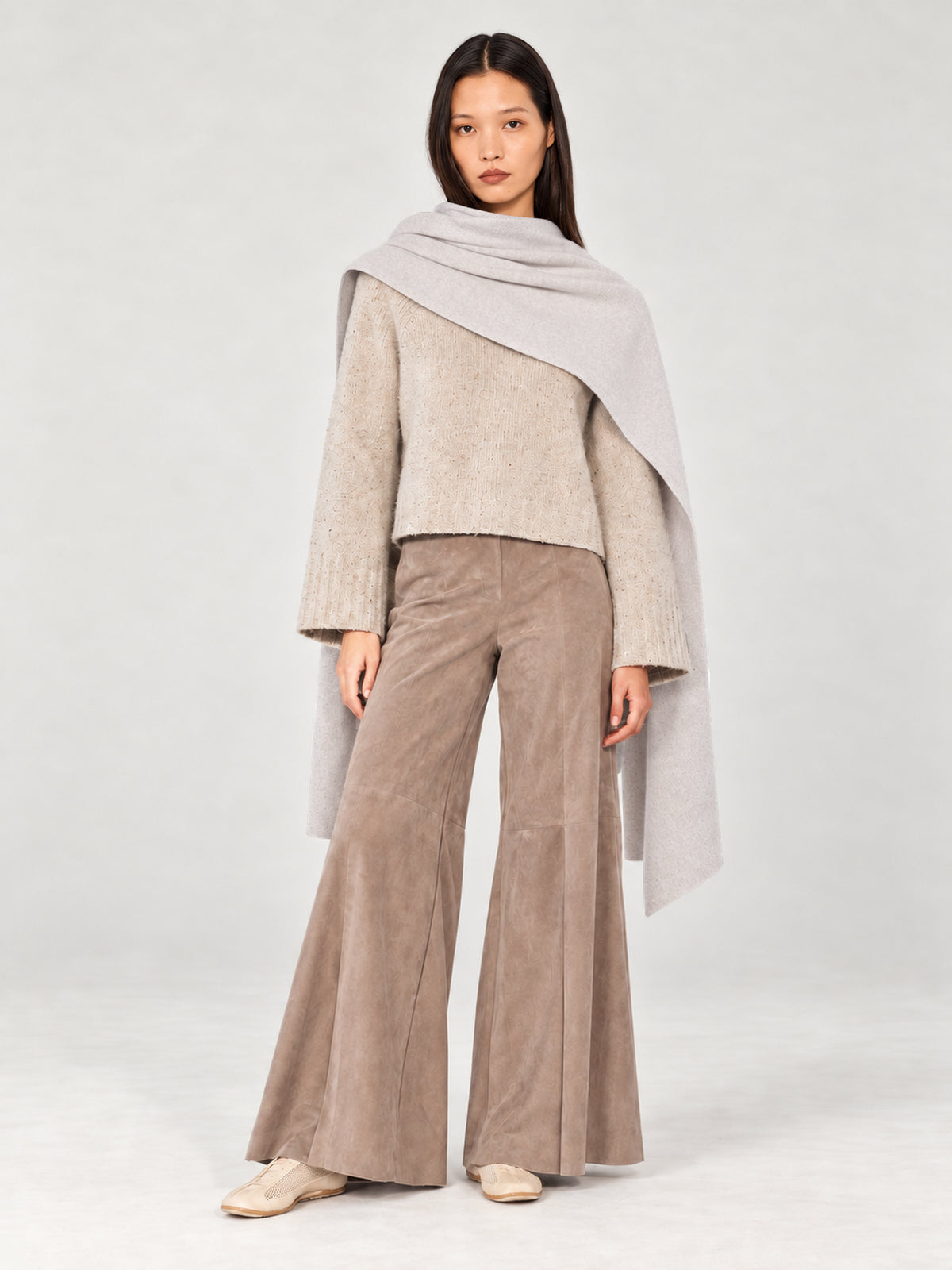 Model wearing the Dom Goor Oyster Donegal Merino wool scarf draped over the shoulders