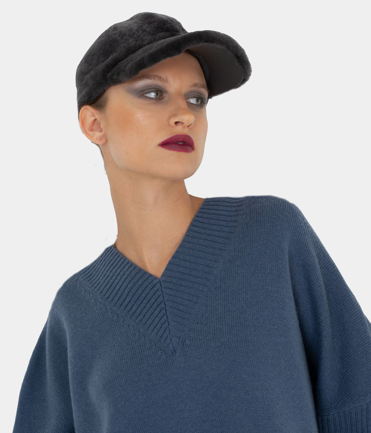 Shadow grey shearling baseball cap by Dom Goor on a model, three-quarter angle