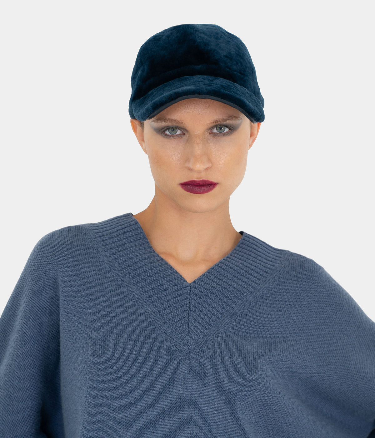 Cerulean blue shearling baseball cap by Dom Goor on a model, front view