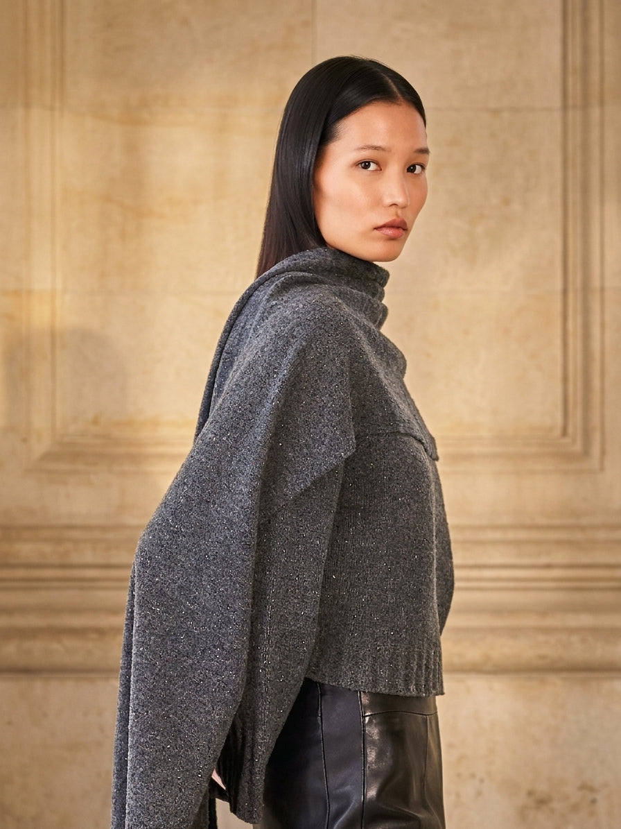 Dom Goor dark grey textured knit roll-neck jumper with wide draped sleeves, worn with black leather trousers