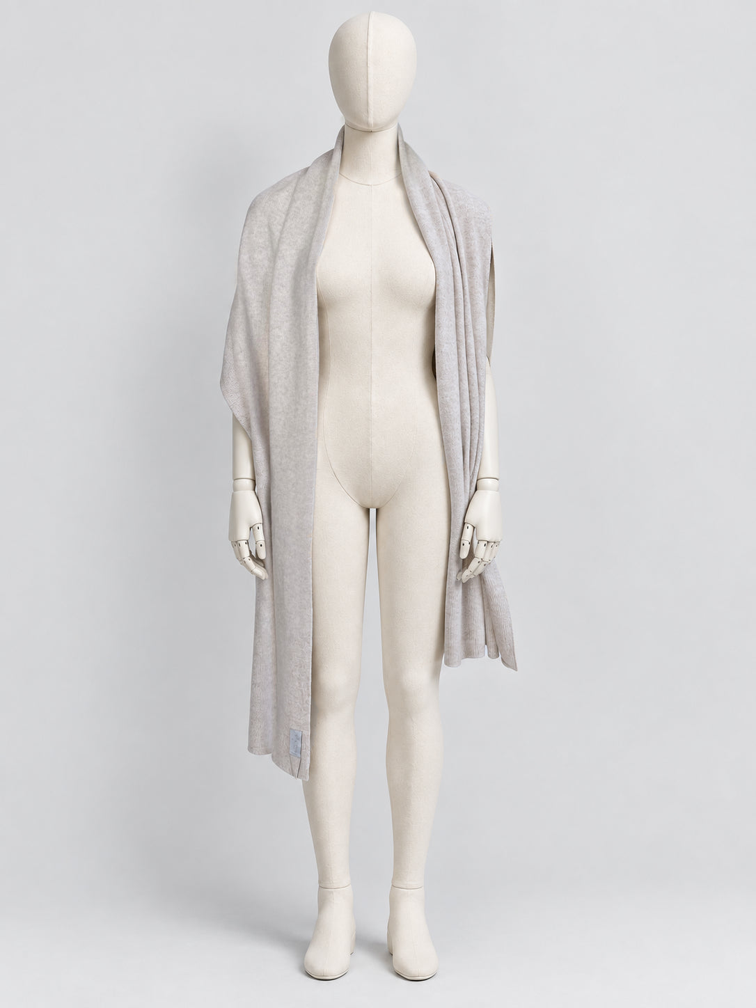 Oyster Donegal Merino wool scarf by Dom Goor worn long on a mannequin, front view