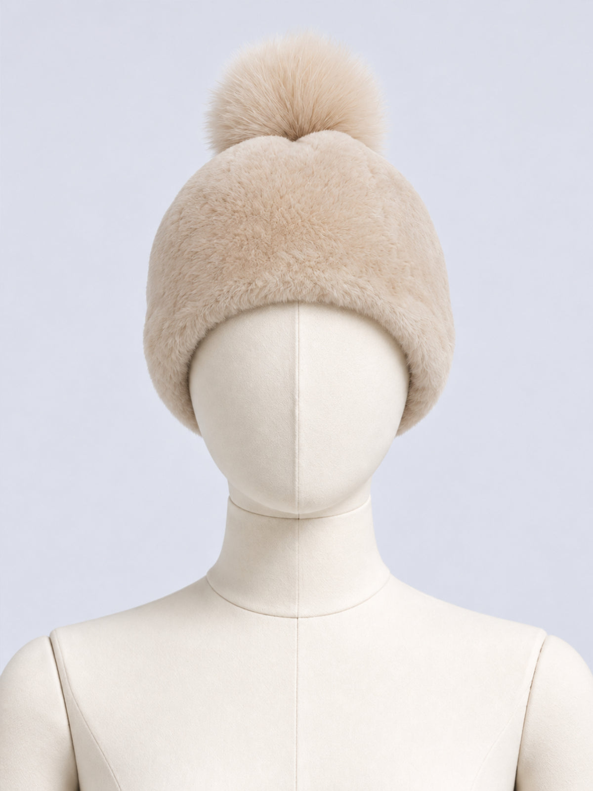 Beige Toscana pompom hat by Dom Goor displayed on a mannequin head
