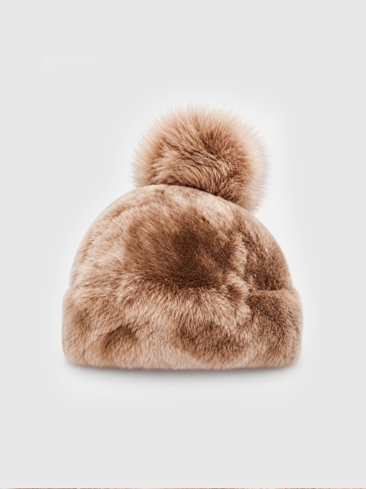 Beige Toscana pompom hat by Dom Goor shown on its own against a grey background