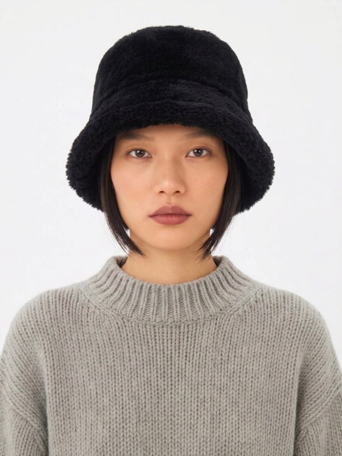 Black shearling bucket hat by Dom Goor on a model, front view